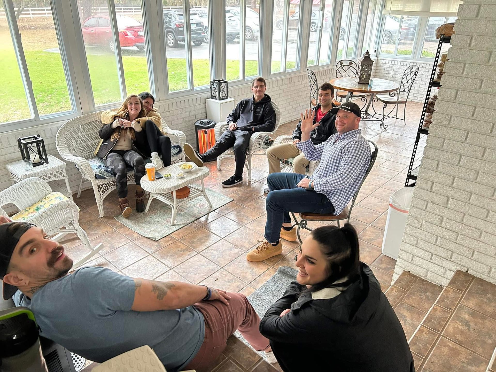 Relaxing in the sunroom at The Palm recovery community